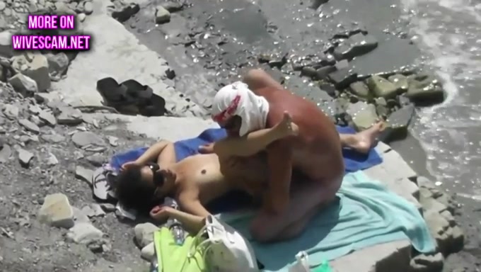 These shameless beach fuckers are enjoying some passionate fuck on the beach