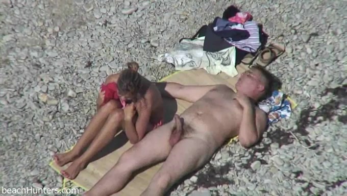 Spy can video of one mommy giving head to her man on the beach