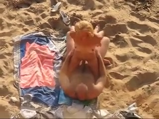 Hidden cam video with a mature amateur couple banging on a beach