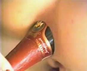 My short-haired brunette chick shows how to store champagne