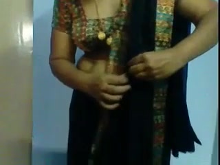 Indian aunty showing how to put on a sari