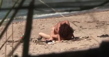 Sexy redhead girlfriend pleased her boyfriend on the beach