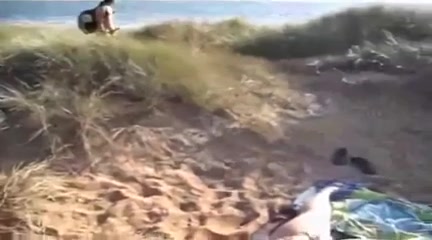 My wife fingers her pussy on a beach after sucking my cock