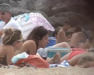 I love spying on bootyful chicks while sunbathing on nude beach