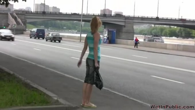Cute blonde Russian lady is all pissed wet on the street