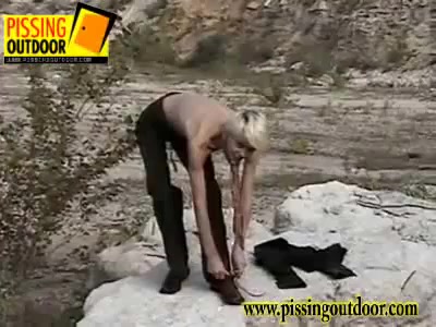 Skinny blondie with long legs gets undressed to pee outdoors