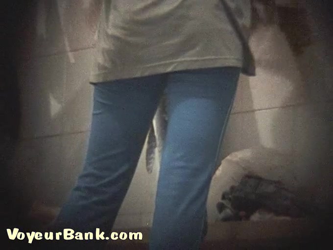 Lean white chick in tight pants undresses and flashes her booty